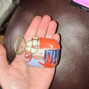 Colorfully designed generation three AirPod Case on keychain.